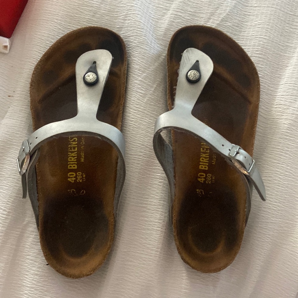 silver Birkenstock flip flops